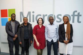 Collaborators of the "AI and the Future of Work in Africa Whitepaper" (L-R): Vukosi Marivate, Dr. Onyi Nwaneri, Jacki O’Neill, Najeeb Abdulhamid, and Winnie Karanu, Microsoft Africa pose for a group photo at an AI Summit hosted at Microsoft South Africa’s offices. COURTESY PHOTO