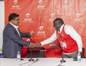 Manoj Murali (left), Managing Director of Airtel Uganda and Hon. Nyombi Thembo (right), UCC Executive Director shake hands after the handover of a cheque of UGX34.8bn to UCC from Airtel Uganda to support Uganda's development of rural communications infrastructure. PHOTO: PC Tech Magazine