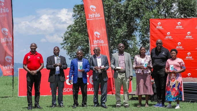 Airtel Uganda and Huawei Technologies Uganda officials pose for a group photo after launching an initiative to empower the people of Kanungu District.