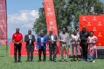 Airtel Uganda and Huawei Technologies Uganda officials pose for a group photo after launching an initiative to empower the people of Kanungu District.