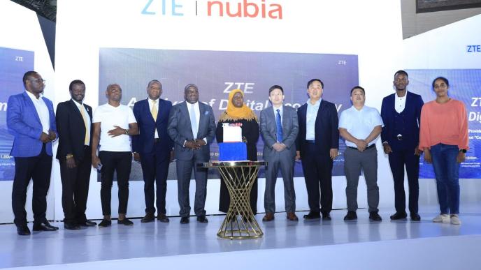 Hon. Minsa Kabanda, Minister for Kampala City and Metropolitan Affairs (C), Hon. Nyombi Thembo, Executive Director, Uganda Communications Commission (6th L), Ali Balunya, Director Sales and Distribution, Airtel Uganda (L), and officials from ZTE Corporation pose for a group photo after launching the ZTE Nubia Smartphone series in Uganda. Courtesy Photo