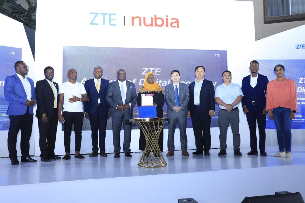 Hon. Minsa Kabanda, Minister for Kampala City and Metropolitan Affairs (C), Hon. Nyombi Thembo, Executive Director, Uganda Communications Commission (6th L), Ali Balunya, Director Sales and Distribution, Airtel Uganda (L), and officials from ZTE Corporation pose for a group photo after launching the ZTE Nubia Smartphone series in Uganda. Courtesy Photo