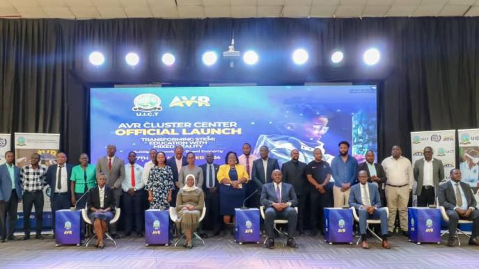 (Front row: L-R): Eng. Christine Mugimba, Dr. Aminah Zawedde, Hon. Dr. Chris Baryomunsi, Dean Munene, and Dr. Fredrick Kitoogo and other officials and attendees pose for a group photo after the launch of the AVR Cluster Center at UICT. Courtesy Photo/UICT