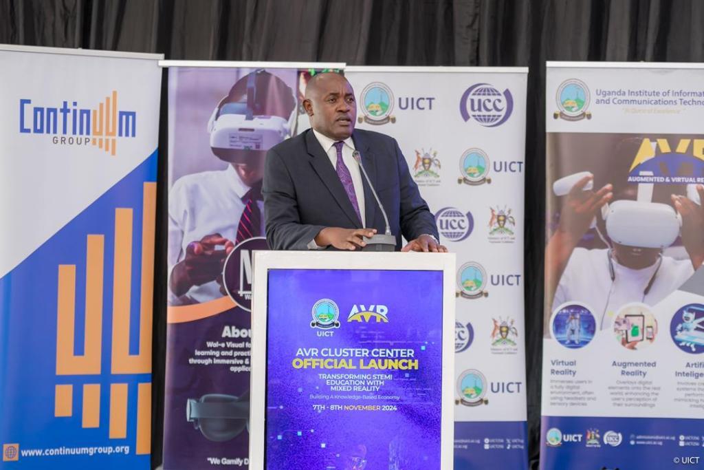 Hon. Dr. Chris Baryomunsi, Minister of ICT and National Guidance speaking at the launch of the AVR Cluster Center at UICT. Courtesy Photo/UICT