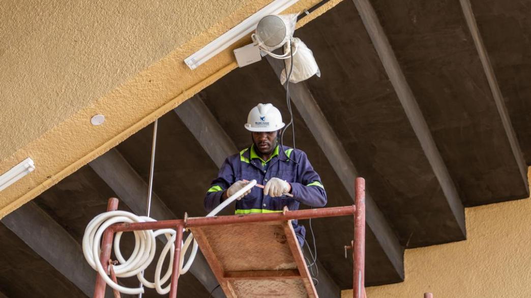 Blue Crane communications engineers at work during the recent Namboole Stadium renovation. PHOTO: BCC