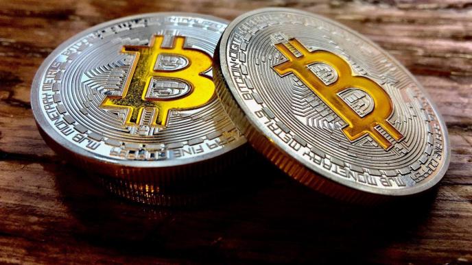 Bitcoin is a digital currency developed in 2008 by someone who used the pseudonym 'Satoshi Nakamoto' and bitcoin can be purchased using your own money or credit cards. (Photo Credit: Synerio Blog)