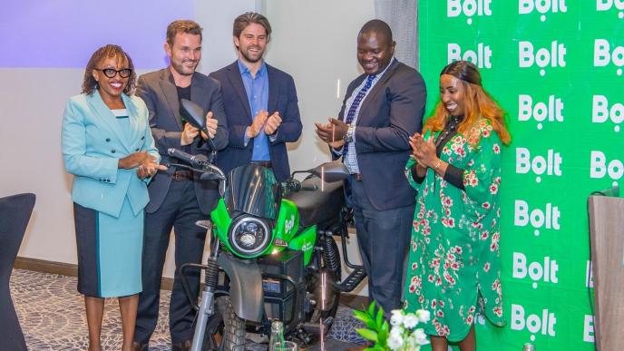 In Pictorial (R-L): Caroline Wanjihia; Bolt Regional Director in Africa, David Damberger; Managing Director of M-KOPA Mobility, Mikael Gånge; CCO of ROAM, Ken Onyango; Chair of the Nairobi Transport Committee and Evaline Wawuda; Sales Coordinator of ROAM pose for a group photo with an electric motorcycle after announcing Bolt and M-KOPA partnership. COURESTY PHOTO