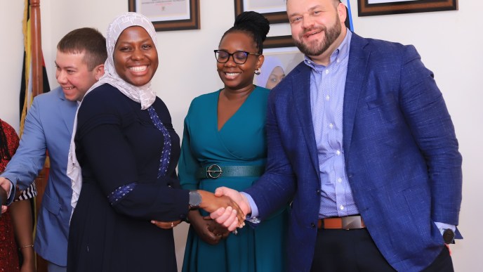 Ministry of ICT Permanent Secretary; Dr. Amina Zawedde (L), Helpware General Manager Africa; Angella Kitandwe (C) and Helpware CEO; Robert Nash (R) share a light moment during Helpware launch at the Makerere University.