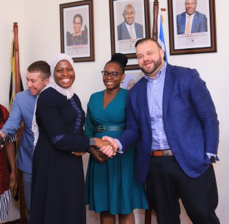 Ministry of ICT Permanent Secretary; Dr. Amina Zawedde (L), Helpware General Manager Africa; Angella Kitandwe (C) and Helpware CEO; Robert Nash (R) share a light moment during Helpware launch at the Makerere University.