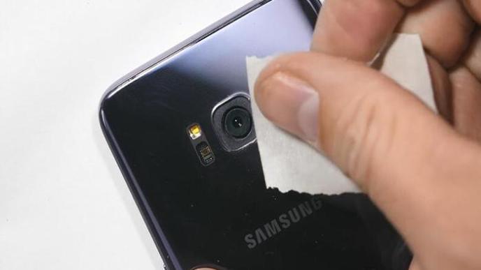 Cleaning a camera of a Samsung smartphone to get better and clear photos and videos. COURTESY PHOTO