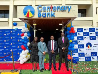 The Centenary Group team pose for a picture outside the newly unveiled bank in Lilongwe, capital of Malawi.