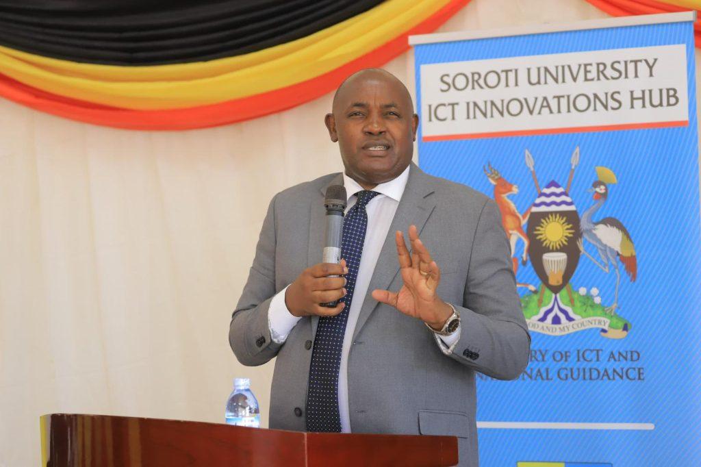 Dr. Chris Baryomunsi, Minister of ICT and National Guidance speaking at the launch of the Soroti University ICT Innovation Hub in Soroti District. COURTESY PHOTO / Ministry of ICT