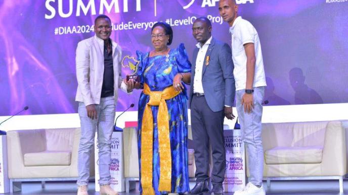 ClinicPesa, a platform making waves in healthcare financing collect their award after winning the Fintech of the Year category in the 2024 Digital Impact Awards Africa. The award was presented to them by Hon. Joyce Nabbosa Ssebugwawo (2nd from left), Minister of State for ICT. PHOTO: HiPipo