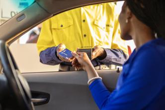 A customer pictured paying using a visa card. COURTESY PHOTO