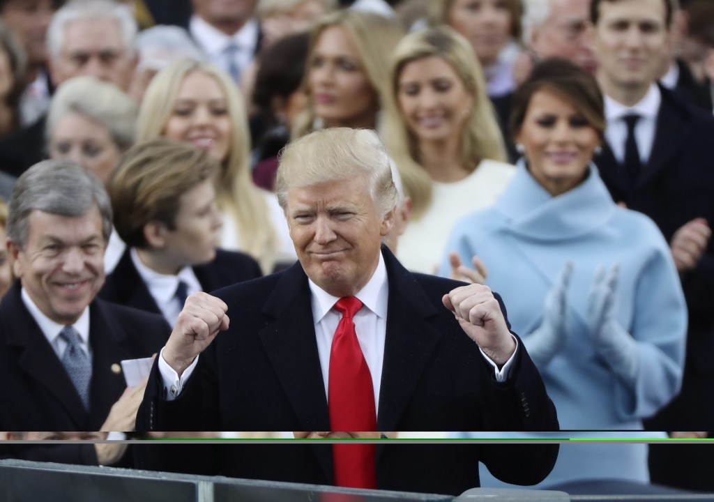 President Donald Trump celebrates after inauguration ceremonies swearing him in as the 45th president of the United States on the West front of the U.S. Capitol in Washington, U.S., January 20, 2017. REUTERS/Carlos Barria (UNITED STATES  - Tags: POLITICS)   - RTSWIU1