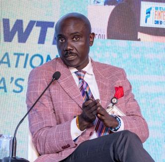 Dr. Twinemanzi Tumubweine, the Executive Director of National Payments at the Bank of Uganda speaking during the 6th FITSPA annual conference at Sheraton Hotel in Kampala. PHOTO: FITSPA