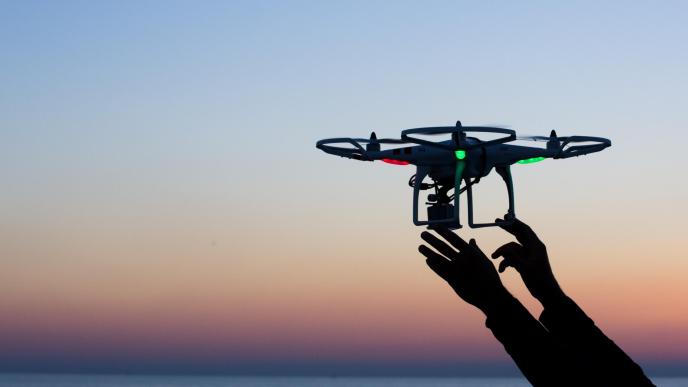 Viareggio, Italy - October 30, 2014: Drone takes off from the operator's hand with camera at sunset Quadcopter industry is told to be growing at triple digitsevery year, for a market expected to pass the 20 billion in the 2020. The dji is a chinese company leader of quadcopter industry, and the phantom is expected to be the top seller gift for christmas 2015. (Photo Credit)