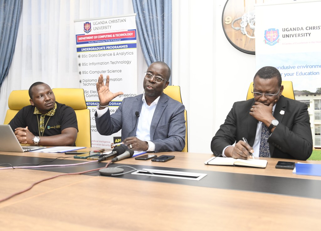 Stephen Mutana (centre); Chief Strategy and Stakeholder Officer at MTN Mobile Money Uganda Ltd addressig the press at the announcement of a partnership between MTN Foundation and UCC to equip students with digital skills.