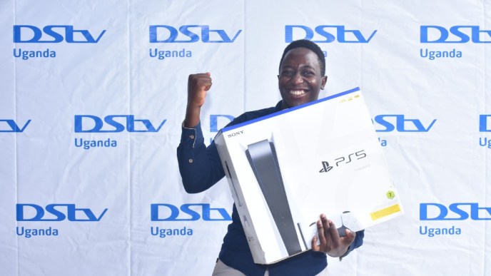 Edward Kategaya joyful after winning a brand new PlayStation 5 (PS5) from DStv Uganda after he gather the most points from DStv's last season fantasy premier league. (PHOTO: DStv Uganda)