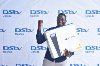 Edward Kategaya joyful after winning a brand new PlayStation 5 (PS5) from DStv Uganda after he gather the most points from DStv's last season fantasy premier league. (PHOTO: DStv Uganda)