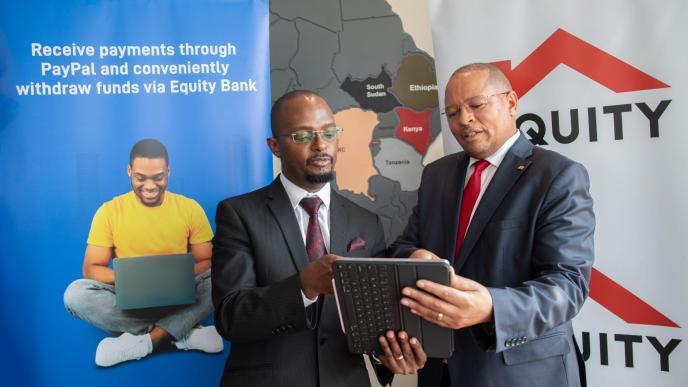 Equity Bank Kenya Managing Director Gerald Warui (right) and Equity Group General Manager, International Banking and Cross Border Payments, Andrew Kabeke (left). COURTEY PHOTO