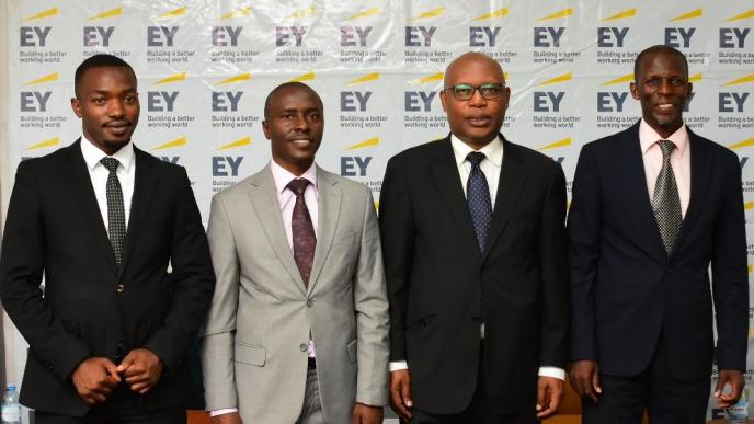 Prosper Ahabwe (2nd from left); Associate Director on Tax at Ernst & Young Uganda and other industrial experts pose for a group photo after discussing the impact of the new proposed tax amendment bills on the fintech sector. COURTESY PHOTO