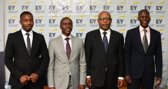 Prosper Ahabwe (2nd from left); Associate Director on Tax at Ernst & Young Uganda and other industrial experts pose for a group photo after discussing the impact of the new proposed tax amendment bills on the fintech sector. COURTESY PHOTO