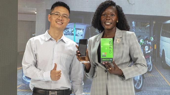 State Minister of Finance for Investment and Privatization, Hon. Anite Evelyn with an Infinix NOTE 40 poses for a photo with Barnett Fan, Infinix Brand Manager. PHOTO: PC Tech Magazine