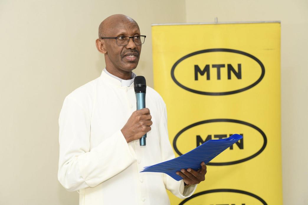 Fr. Eugene Safari, the Rector of St. Joseph’s Seminary Nyenga speaking at the handover ceremony of a newly built computer lab by MTN Foundation to the school. Courtesy Photo