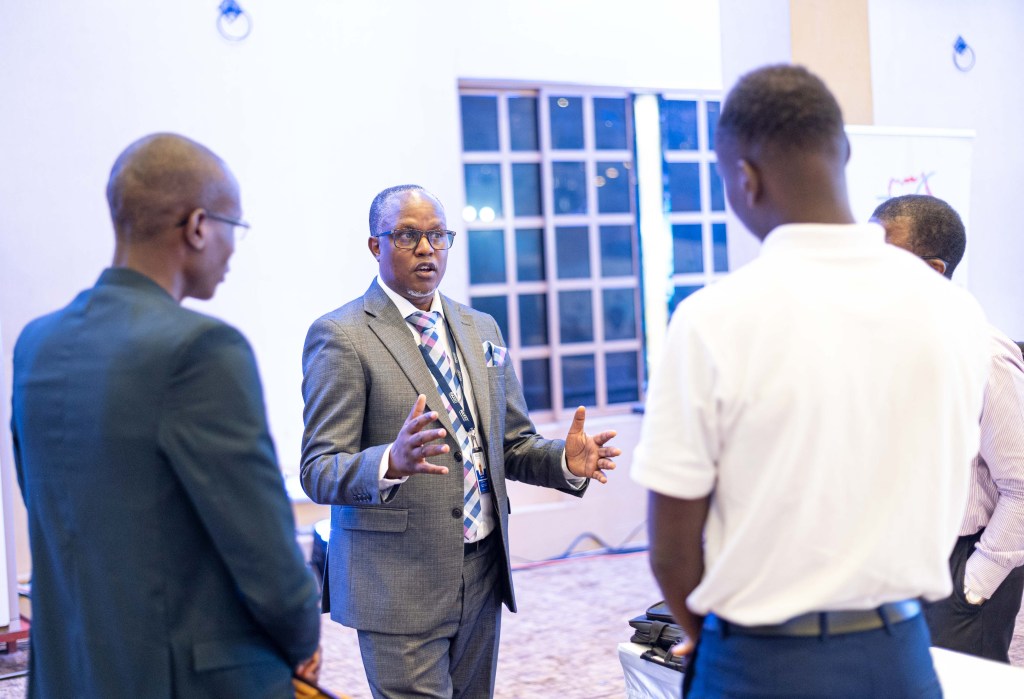 Godfrey Sserwamukoko, General Manager of Raxio Data Centre engages with fellow ICT players at the 2024 Renu ICT Directors Forum held from July 18 to 19, 2024, at Speke Resort Munyonyo. Courtesy Photo/Raxio