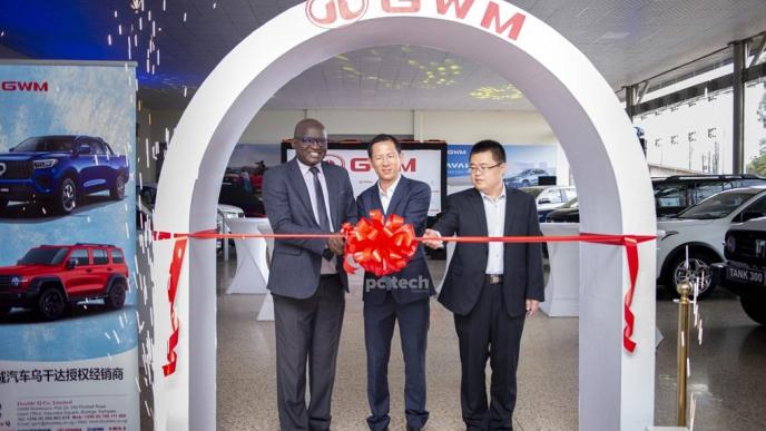 (left to right) Eng. Dr. Timothy Tibesigwa, Double Q Managing Director; Bruce Lin, and a global representative from GWM unveiling cutting the ribbon to officially unveil the GWM showroom in Uganda while looks on. PHOTO: PC Tech Magazine