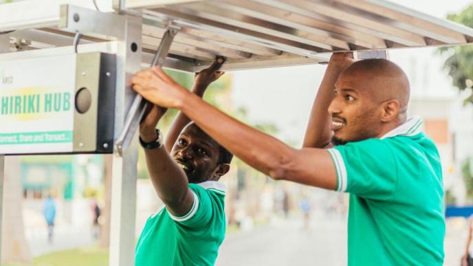 Henri Nyakarundi (right) founder of ARED and his colleague assembling a Shiriki Hub. COURTESY PHOTO/Philippe Nyirimihigo