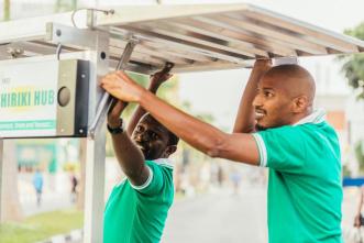 Henri Nyakarundi (right) founder of ARED and his colleague assembling a Shiriki Hub. COURTESY PHOTO/Philippe Nyirimihigo