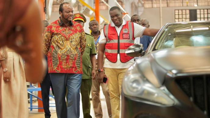 Kiira Motors Cooperation, CEO, Paul Isaac Musasizi (right) show off an electric vehicle (EV) manufactured and assembled at the cooperation's plant to His Majesty Mswati III (left), King of Eswatini. COURTESY PHOTO