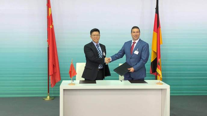 Chinese Premier; Li Keqiang and German Chancellor; Angela Merkel shake hands after signing the Memorandum of Understanding (MoU) for the development of intelligent connected vehicles.