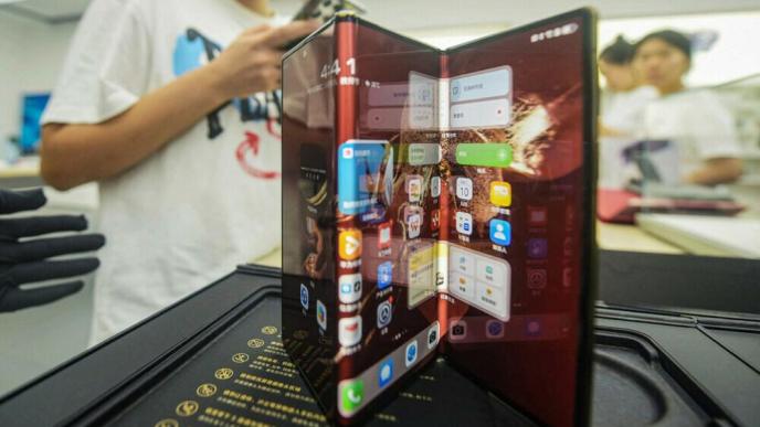 Chinese tech giant Huawei’s new trifold phone Huawei Mate XT is displayed during its launch day at a Huawei store in Hangzhou, in eastern China’s Zhejiang province on September 10, 2024. Photo: AFP