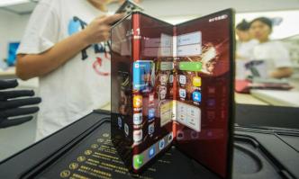 Chinese tech giant Huawei’s new trifold phone Huawei Mate XT is displayed during its launch day at a Huawei store in Hangzhou, in eastern China’s Zhejiang province on September 10, 2024. Photo: AFP