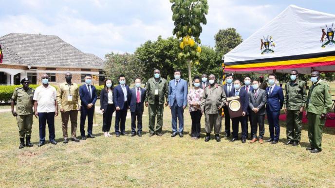 President Yoweri Kaguta Museveni (in a white mask) with a delegation from Huawei Technologies Uganda, and Ministers pose for a group photo after a meeting to establish a Digital Village Prototype in Uganda. Meeting was held at the National Leadership Institute NALI Kyankwanzi on Tuesday, July 9th, 2024. PHOTO: State House Uganda / PPU