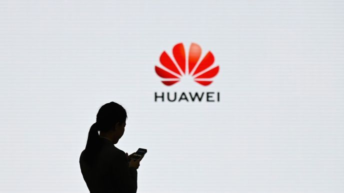 Women standing next to Huawei logo. (COURTESSY PHOTO)