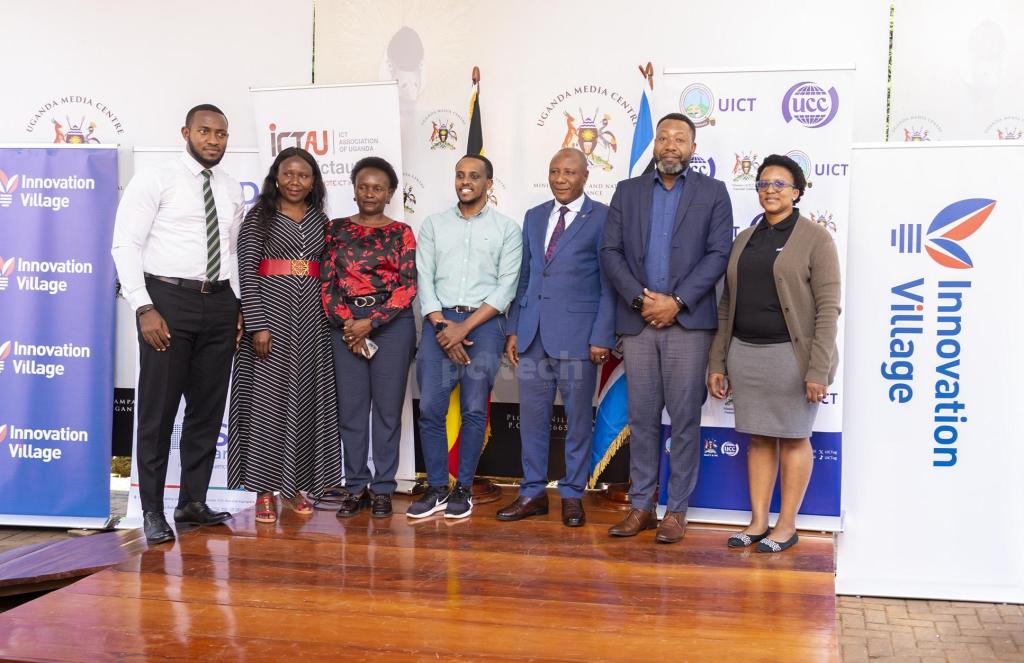 The Minister of State for National Guidance; Hon. Kabbyanga Godfrey Baluku (3rd from right) poses for a group photo with partners of the inaugural ICT National Summit. PHOTO: PC Tech Magazine