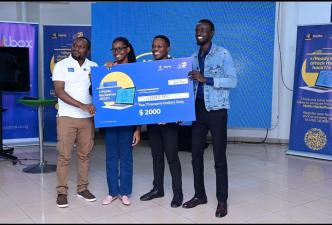 Richard Zulu (extreme left), Co-Founder of OutBox Hub hands over a dummy cheque to the develops of SharePay after securing the 3rd place in the 2023 MTN MoMo Hackathon. COURTESY PHOTO