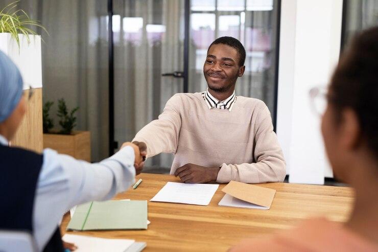 Man handshaking his employer after after an interview. PHOTO: Freepik