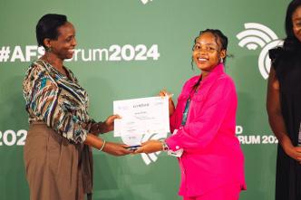 Ecobed Biotech, Director and CEO, Jovia Kisaakye (right) receiving her certificate of recognition and an accolade after winning the Young Female Agripreneur (Rising Star) at 2024 WAYA. COURTESY PHOTO