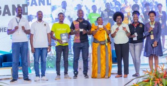 Representatives from KaCyber Technologies, the STI Secretariat, Kiira Motors Corporation pose for a group photo with Prime Minister, Rt. Hon Robinah Nabbanja (in gomesi), and Hon. Dr. Monica Musenero Masanza (3rd from right); Minister for Science, Technology & Innovation after launching KaCyber first contactless transport card.