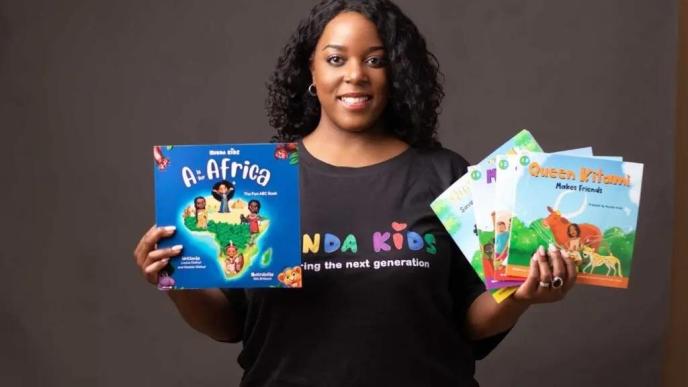 Louisa Kiwana, Co-founder and Director of Kunda Kids Limited poses with some books the company publishes. COURTESY PHOTO