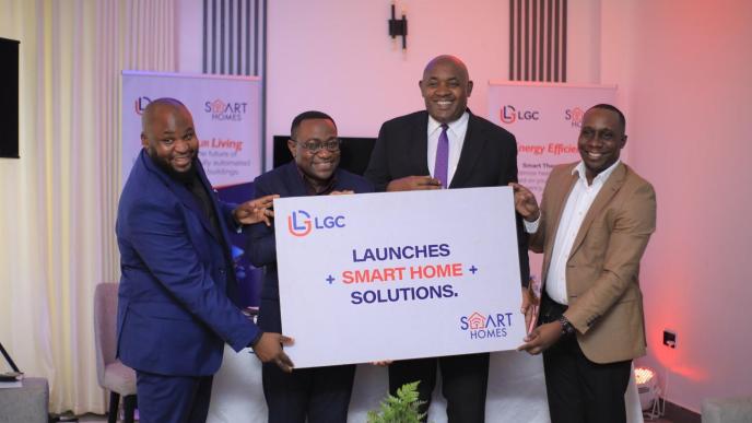 Hon. Chris Baryomunsi (2nd from right) and team from LGC Enterprises (U) Ltd hold pluck card launching the smart homes project at Ham Palm Villas in Uganda.