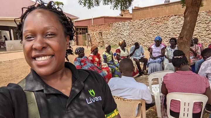 Maxima Nsimenta, founder of Livara taking a selfie with shea farmers (in the background) in Pader District in Northern Uganda. PHOTO: Livara