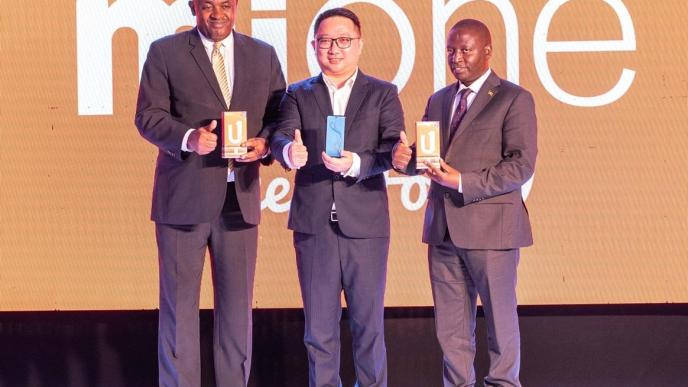 (In pictorial L-R): Minister of ICT and National Guidance; Hon. Chris Baryomunsi, Ben Yu; Mione Brand Representative in Uganda, and State Minister for Trade; Industry and Cooperatives; Hon. David Bahati display the Mione U1 and Mione Joy 9 at their launch event at Four Points by Sheraton in Kampala.