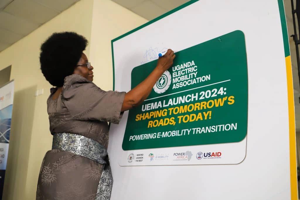 Dr. Monica Musenero Masanza, Minister for Science, Technology, and Innovation signing on a pluckcard after launching the Uganda Electric Mobility Association (UEMA). Courtesy Photo