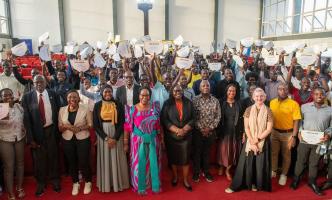 Minister of State for ICT and National Guidance, Joyce Ssebugwawo (In a gomesi), executives from private sector players including MTN Uganda, celebrates with the inaugural MTN ACE Program graduates at the National ICT Hub in Nakawa, September 7, 2023.